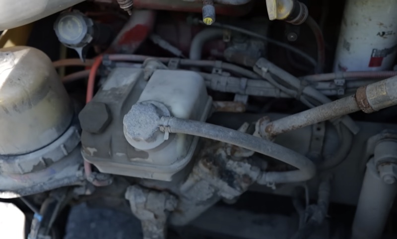 Worn power steering pump and hydraulic lines on a semi truck
