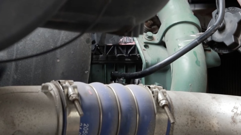 Coolant hoses and turbo piping on a semi truck engine
